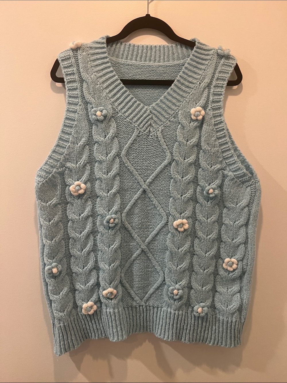 Light blue with flower details knitted vest